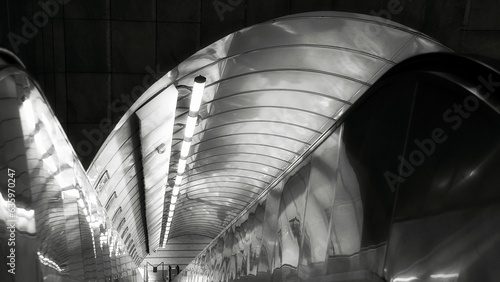 escalator at night in a black and white image photo