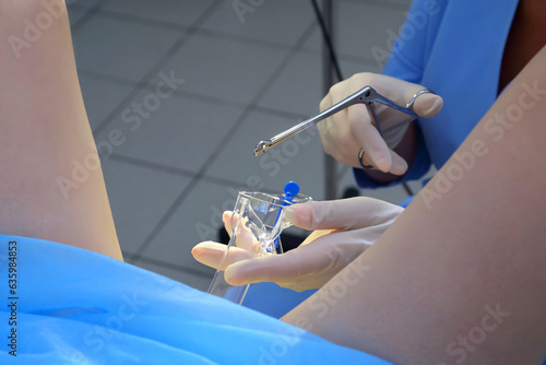 A gynecologist performs a cervical biopsy. Gynecological chair. A woman at the gynecologist for a check-up.