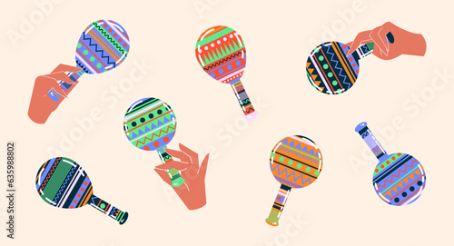 Mexican maracas. Musical instrument maracas. Hand holds colorful maracas, maraca cartoon style. Mexican holiday attribute, traditional Latin musical instrumen.