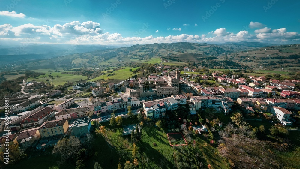 Aerial shot of the beautiful buildings of the medieval Tavoleto village in Italy on a sunny day