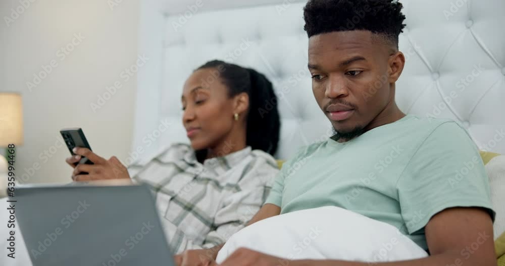 Laptop, phone and black couple relax in bed with tech, network connection or search on social media for news or info. People, online and mobile app user typing or reading on internet in bedroom Laptop, phone and black couple relax in bed with tech, network connection or search on social media for news or info. People, online and mobile app user typing or reading on internet in bedroom
