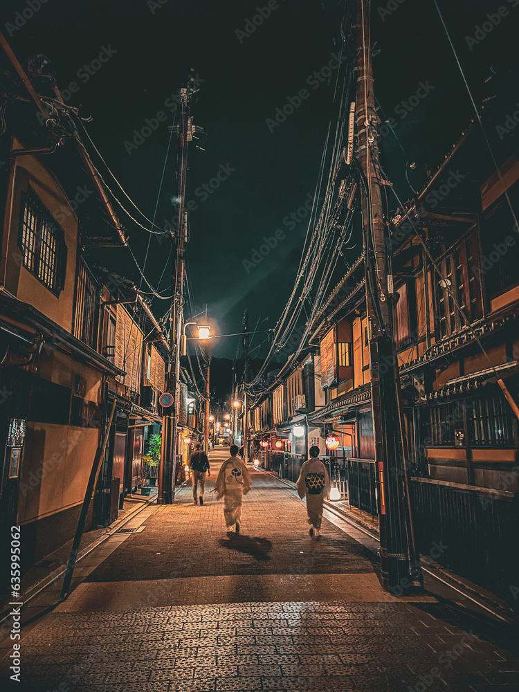 Kyoto, city by night. walking geisha on the street. Beautiful Japan. Traditional architecture. 