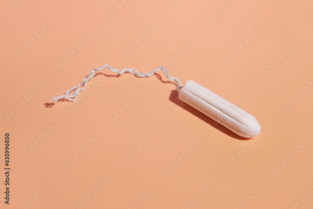 hygienic tampon on a light background, the concept of hygiene of critical days hygienic tampon on a light background, the concept of hygiene of critical days