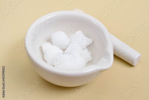 Camphor is a waxy, colorless solid with a strong aroma photo