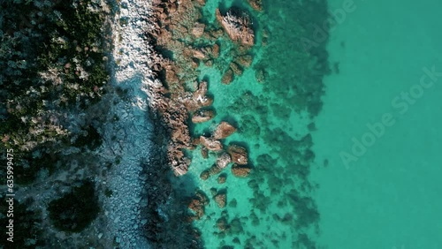 Drone footage over turquoise Grotticelle beach in Calabria and crystal clear Caribbean sea, Italy photo