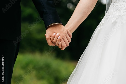 two people are holding hands and they're looking at each other
