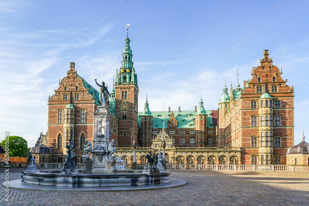 Fototapeta premium Neptune Fountain in a front of Frederiksborg castle courtyard facade in Hillerod, Denmark
