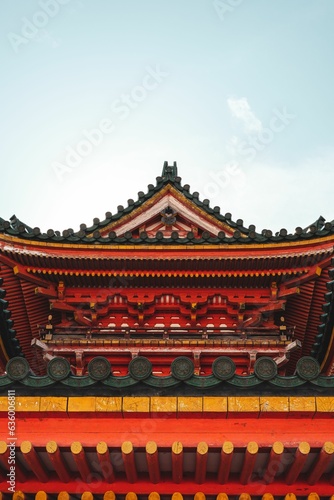 Vertical shot of a red historic shrine in Japan