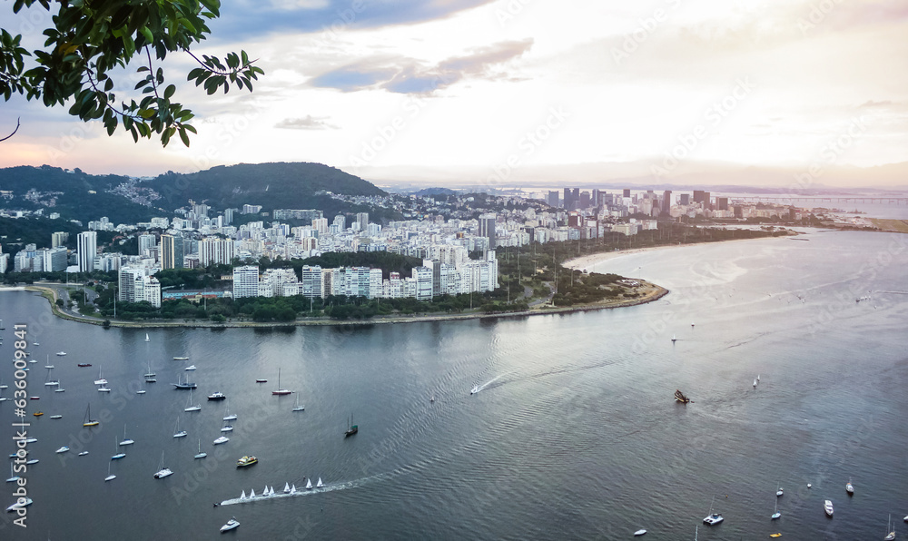 Panorama aerial view of landscape Rio de Janeiro, Brazil at sunset, beachfront district. Panoramic of Rio city cityscape at mountains background. Urban wallpaper concept. Copy ad text space banner