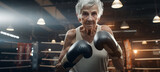 Older grandma senior at the boxing gym training. Concept of Active aging, senior fitness, unconventional training, boxing workout, grandma's determination, health and wellness.