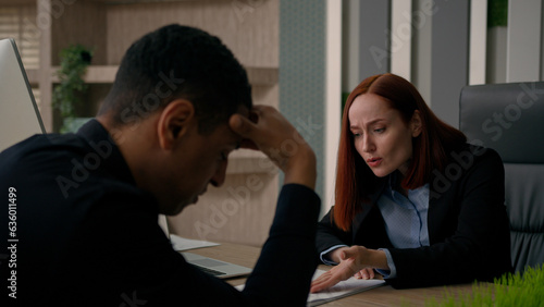 Angry businesswoman displeased leader screaming at office worker demanding boss annoyed at employee work contract problem document mistakes shout multiracial woman and man quarrel in business company