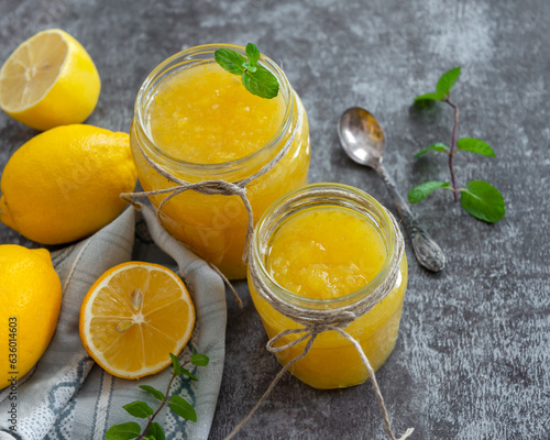 Freshly made homemade lemon jam in glass jars.