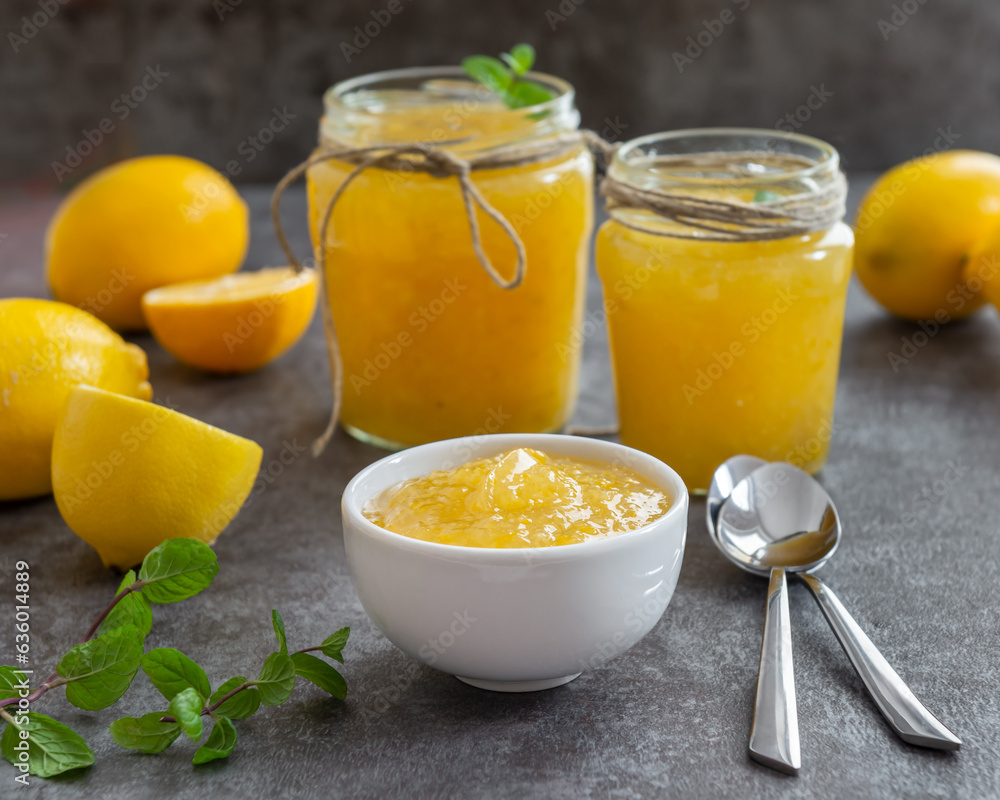 Freshly made homemade lemon jam in glass jars. Freshly made homemade lemon jam in glass jars.