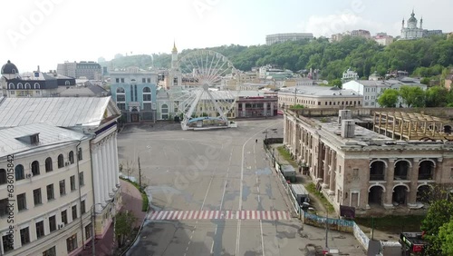 Abandoned street during pandemic lockdown, Ferris Wheel on Podil in Kyiv, Ukraine photo