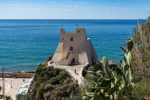 View of Torre Truglia Tower against the background of blue waters and sky. Sperlonga, Italy. photo