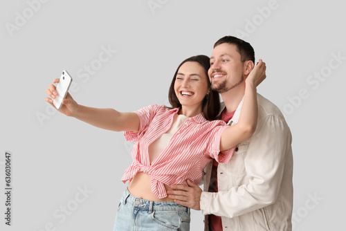 Happy young couple with mob...