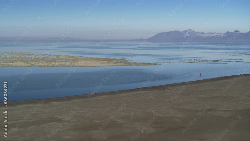 Aerial flyover view of receding water in Great Salt Lake / Magna, Utah, United States Aerial flyover view of receding water in Great Salt Lake / Magna, Utah, United States
