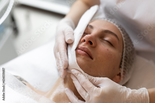 Doctor works with patient in dermatology clinic