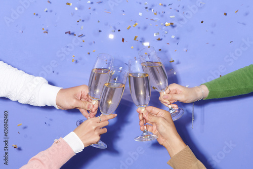 Dinner party with drinking of champagne. hands holding clear glass photo