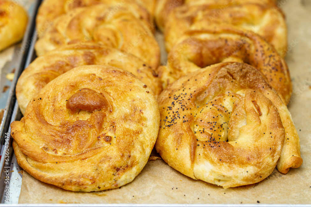 Baking from puff pastry, Vertuta or placinda. Appetizing pastries. Fast food. Snack from the bakery for a break.