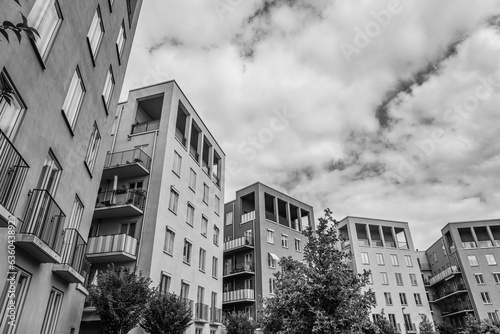 Low angle view of apartment buildings in black and white