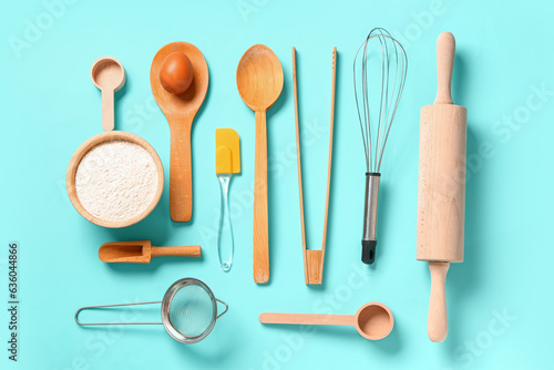 Wooden baking utensils on turquoise background