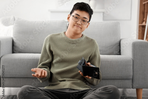 Young Asian man with empty ...