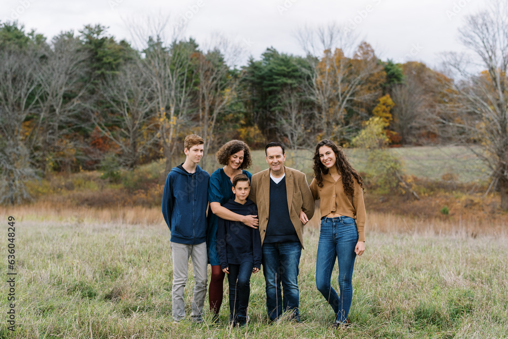 Happy family with teenage children laughing together Happy family with teenage children laughing together