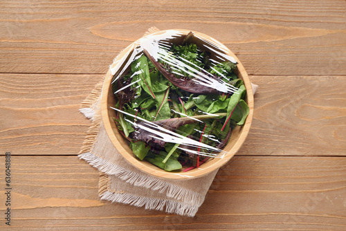 Bowl of fresh salad covered...