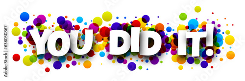 You did it sign over colorful round dots background.