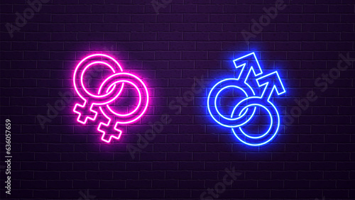 Neon glowing icons of lesbian and homosexual gender on a brick wall background.