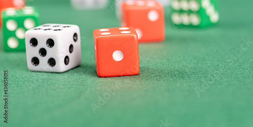 Dice, beautiful dice placed on green felt surface, selective focus.