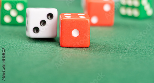 Dice, beautiful dice placed on green felt surface, selective focus.