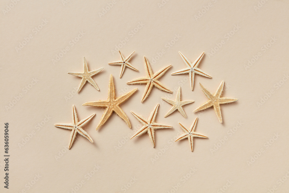 Pattern of natural starfish on beige background. Pattern of natural starfish on beige background.