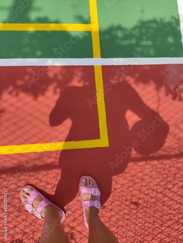 shadow selfie on tennis court
 photo