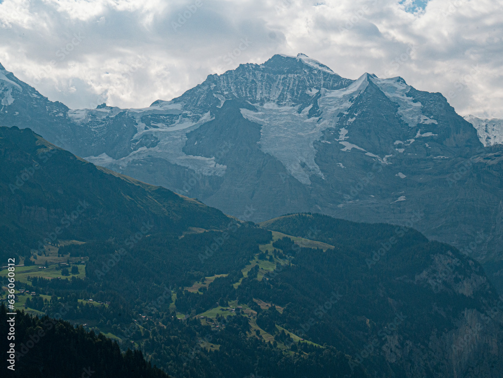 Jungfrau Mountainpeak alps 4500m cloudy day huge Glaciers Lauterbrunnen village in swiss Alps