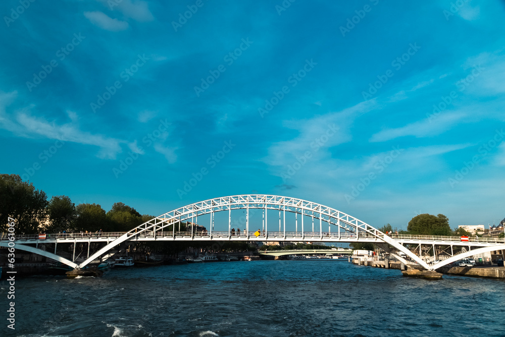 Paris, France. April 22, 2022: Debilly footbridge with Paris bridge and Seine river.