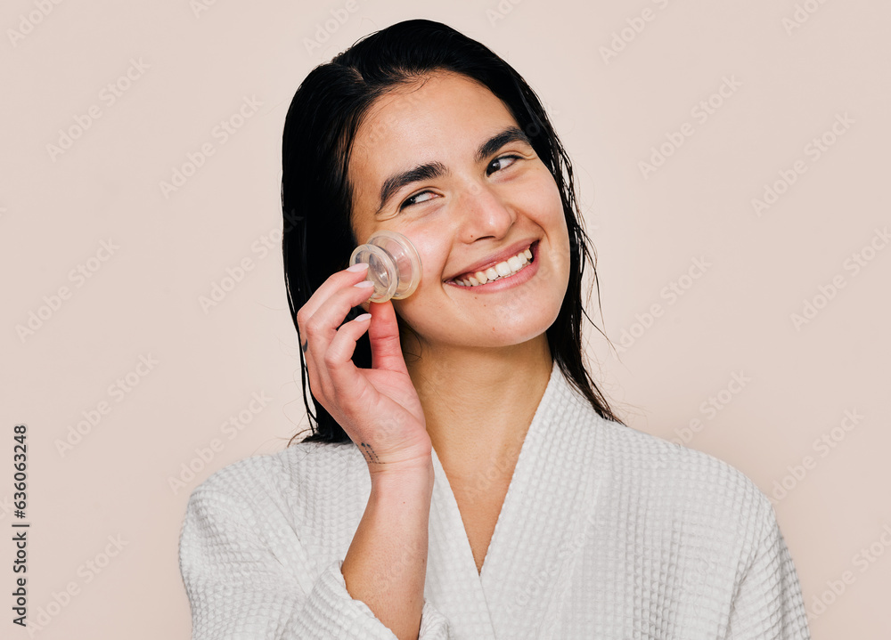 Woman giddy about her facial cupping beauty product Woman giddy about her facial cupping beauty product