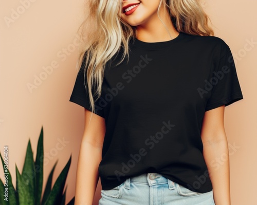 Black Shirt Mockup, Oversized Blank T-Shirt Template, Fashion, Female, Girl, Women, Model, Wearing a Black Tee Shirt, Jeans, Standing In Room With The Plant.	 photo