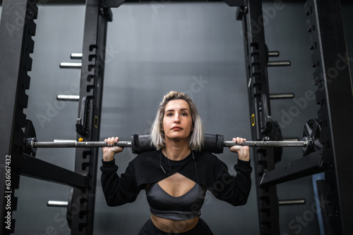 young woman training in a gym photo