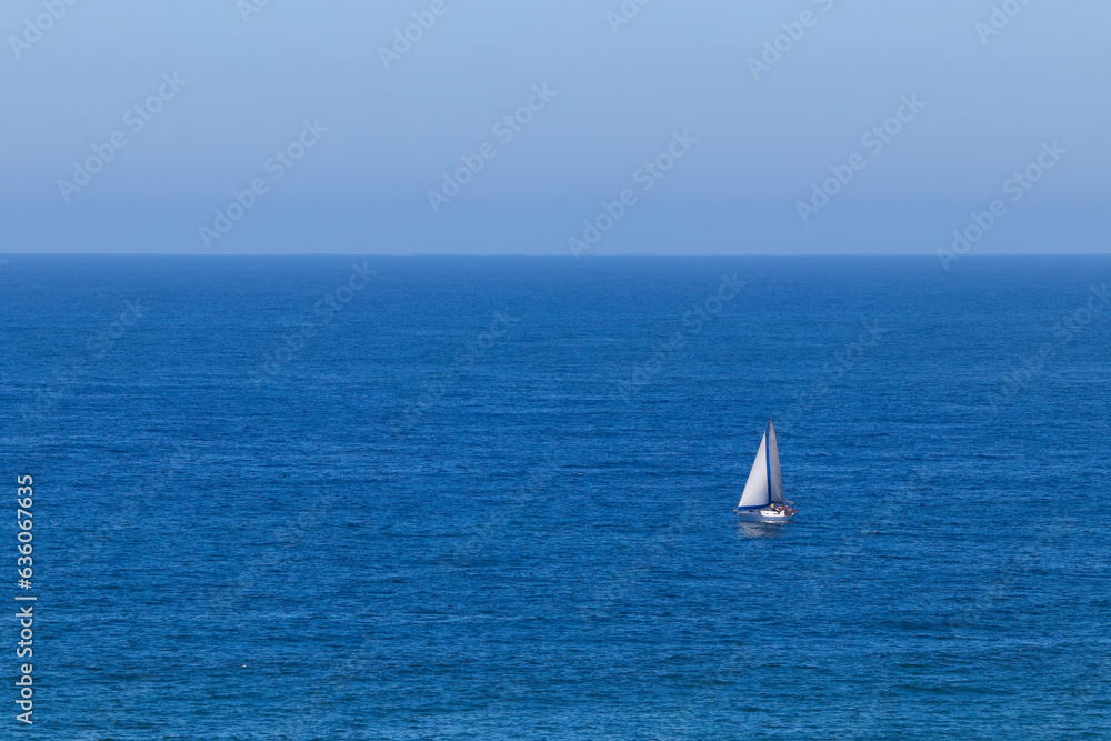 Small Cabin Yacht On Open Blue Ocean