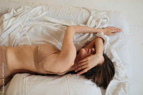Woman sleep on bed photo