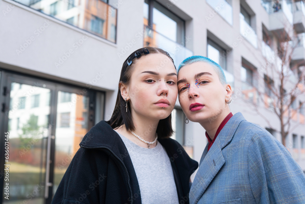 Stylish female friends with dyed hair in urban city Stylish female friends with dyed hair in urban city