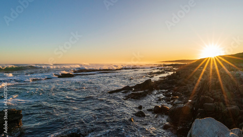 Sunset by the seaside at Schoenmakerskop, Port Elizabet, South Africa photo