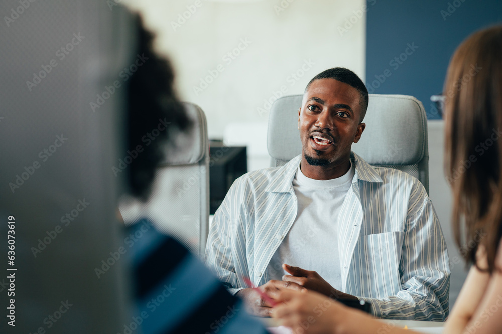 Man in Office Having Meeting with His Colleagues Man in Office Having Meeting with His Colleagues