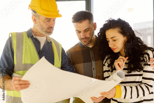 Clients Check Architecture Plan Construction Site photo