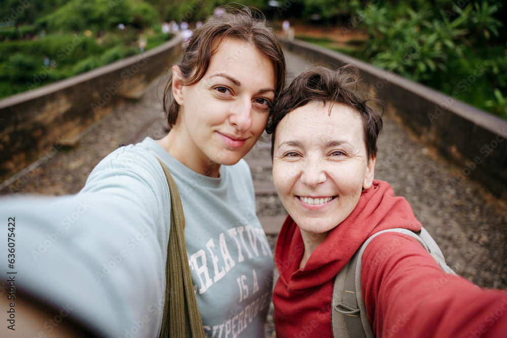 A couple of women on a journey portrait selfie A couple of women on a journey portrait selfie