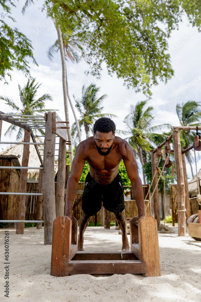 Man doing push-Ups on bars Man doing push-Ups on bars