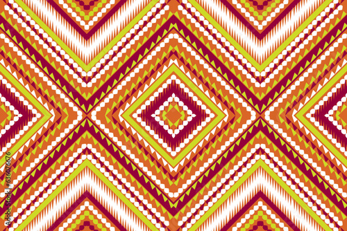 Seamless design pattern, traditional geometric zigzag pattern.orange red white yellow vector illustration design, abstract fabric pattern, aztec style for print textiles  © suthat