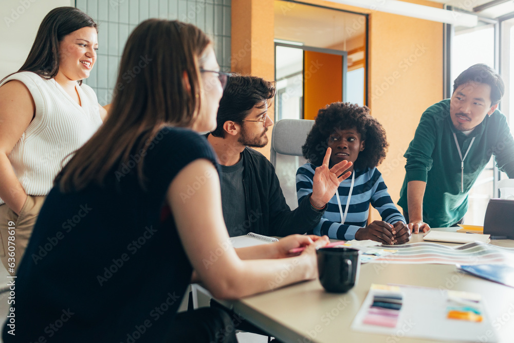 Young Businesspeople Having Meeting in Office Young Businesspeople Having Meeting in Office